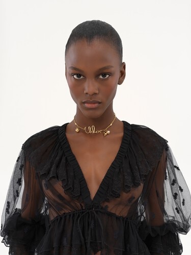 V-neck ruffle top in embroidered lace - 8