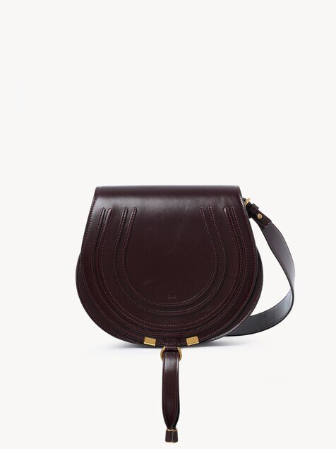 Bolso saddle Marcie de cuero brillante