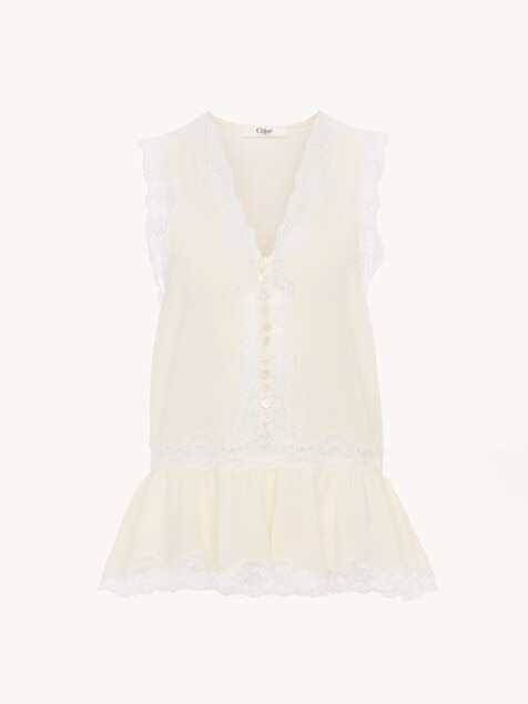 Sleeveless peplum top in cr&ecirc;pe de chine & lace