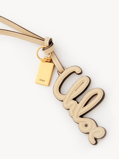Logo bag charm in shiny leather