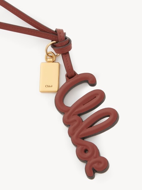 Logo bag charm in shiny leather