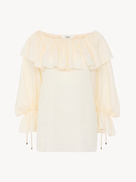 Top fluido con volantes de jacquard de seda